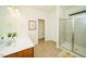 Bathroom featuring double sinks, and a glass-enclosed shower at 612 Marian Way, Sanford, NC 27330