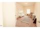 Neutral-toned Bedroom with a white crib, rocking chair, and minimalist decor at 612 Marian Way, Sanford, NC 27330