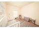 Charming Bedroom with a crib, rocking chair, and plenty of natural light at 612 Marian Way, Sanford, NC 27330