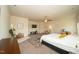 Bright bedroom features carpet, ceiling fan, large bed, and ensuite bathroom access at 612 Marian Way, Sanford, NC 27330