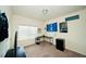Comfortable bedroom with a desk, window view, and sporty decorations at 612 Marian Way, Sanford, NC 27330