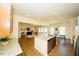 Open-concept kitchen featuring granite countertops, an island, and stainless steel appliances at 612 Marian Way, Sanford, NC 27330