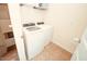Laundry room featuring a washer, dryer, and a wire rack shelf at 612 Marian Way, Sanford, NC 27330