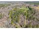 Scenic aerial view of a heavily wooded lot with mature trees and defined property lines, offering privacy and natural beauty at 6610 Maynard Farm Rd, Chapel Hill, NC 27516