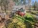 Inviting outdoor space features a spacious deck, lush greenery, and mature trees, creating a perfect area for relaxation at 6610 Maynard Farm Rd, Chapel Hill, NC 27516