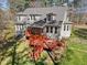 Backyard featuring a tiered deck, and mature trees at 6610 Maynard Farm Rd, Chapel Hill, NC 27516