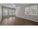 Bright bedroom features hardwood floors and plenty of natural light from multiple windows at 6610 Maynard Farm Rd, Chapel Hill, NC 27516