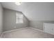 Cozy bedroom offering comfortable carpeting, storage, natural light, and neutral color palette at 6610 Maynard Farm Rd, Chapel Hill, NC 27516