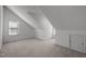 Attic bedroom with carpeted floors, a window, and neutral paint at 6610 Maynard Farm Rd, Chapel Hill, NC 27516