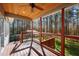 Inviting deck showcases a rustic wooden ceiling and cable railing with scenic views at 6610 Maynard Farm Rd, Chapel Hill, NC 27516