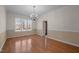 Bright dining room featuring hardwood floors and a chandelier at 6610 Maynard Farm Rd, Chapel Hill, NC 27516