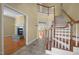 Open foyer featuring hardwood floors, a staircase, and views into living spaces at 6610 Maynard Farm Rd, Chapel Hill, NC 27516