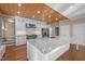 Kitchen boasts a large island with granite countertops, stainless steel appliances, and wood ceilings at 6610 Maynard Farm Rd, Chapel Hill, NC 27516