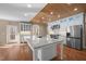 Gourmet kitchen boasts a large island with granite countertops, stainless steel appliances, and wood ceilings at 6610 Maynard Farm Rd, Chapel Hill, NC 27516