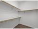 Spacious walk-in closet with shelving and hardwood floors at 6610 Maynard Farm Rd, Chapel Hill, NC 27516