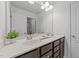 Bright bathroom features a double vanity with generous counter space and ample storage at 705 Prince Dr, Holly Springs, NC 27540