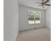 Empty bedroom with carpet and a large window providing plenty of natural light at 705 Prince Dr, Holly Springs, NC 27540