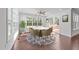 Bright dining area featuring hardwood floors, natural light, and access to the deck at 705 Prince Dr, Holly Springs, NC 27540