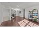 Upstairs hallway boasts hardwood floors, abundant light, and open access to various rooms at 705 Prince Dr, Holly Springs, NC 27540