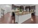 Spacious kitchen island with granite countertops and modern stainless steel appliances at 705 Prince Dr, Holly Springs, NC 27540