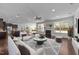 Bright living room with fireplace, open floorplan and large windows offering lots of natural light at 705 Prince Dr, Holly Springs, NC 27540