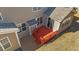 An aerial view shows a red deck with adjacent slider and windows, enhancing outdoor living at 705 Prince Dr, Holly Springs, NC 27540