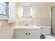 This charming bathroom features a lighted mirror and classic tilework at 709 S Sellars Mill Rd, Burlington, NC 27217