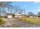 Charming single-story brick home with a spacious driveway and an attached two-car garage at 709 S Sellars Mill Rd, Burlington, NC 27217