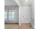 Bright foyer featuring a white door and trim, with a window for ample natural light at 709 S Sellars Mill Rd, Burlington, NC 27217