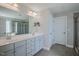 Spacious bathroom with a double vanity, large mirror, tiled floor, and a separate shower and tub at 71 Del Corso Ct, Clayton, NC 27527