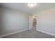 A carpeted bedroom with neutral-colored walls, and an en-suite bath at 71 Del Corso Ct, Clayton, NC 27527