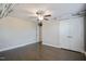 A bedroom with hardwood floors, a ceiling fan, and gray walls at 71 Del Corso Ct, Clayton, NC 27527