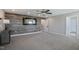 Spacious bedroom with a decorative wood accent wall, an elegant mirror, recessed lighting, and a ceiling fan at 71 Del Corso Ct, Clayton, NC 27527