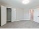 A large, carpeted bedroom with a closet and an en-suite bath at 71 Del Corso Ct, Clayton, NC 27527