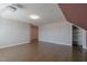 Attic bonus room with hardwood floors and built in shelving at 71 Del Corso Ct, Clayton, NC 27527