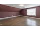 Attic bonus room with hardwood floors and a projector at 71 Del Corso Ct, Clayton, NC 27527