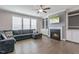 Spacious living room with a fireplace, built-in cabinets, and hardwood floors at 71 Del Corso Ct, Clayton, NC 27527