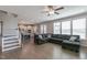 Open-concept living room showing stairs and view into kitchen at 71 Del Corso Ct, Clayton, NC 27527