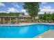Resort-style pool with ample seating and a clubhouse in a landscaped setting at 71 Del Corso Ct, Clayton, NC 27527