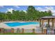 Community pool area with lounge chairs and a gazebo for relaxation and shade at 71 Del Corso Ct, Clayton, NC 27527