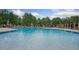 Inviting community pool with fountain features and plenty of lounge seating at 71 Del Corso Ct, Clayton, NC 27527