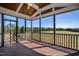Expansive screened-in porch with wood flooring and a stunning backyard view at 71 Del Corso Ct, Clayton, NC 27527