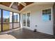 Screened porch with ceiling fan, wood ceiling and wooden floor at 71 Del Corso Ct, Clayton, NC 27527