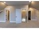 Finished attic space with multiple doorways and neutral carpeting at 717 Penn Rd, Raleigh, NC 27604