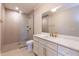 Modern bathroom featuring a glass-enclosed shower and white vanity with gold fixtures at 717 Penn Rd, Raleigh, NC 27604
