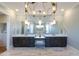 Elegant bathroom featuring dual sinks, decorative lighting, and marble floors create a luxurious retreat at 717 Penn Rd, Raleigh, NC 27604