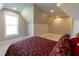 Cozy bedroom with angled ceilings, carpeted floors and a comfortable bed at 717 Penn Rd, Raleigh, NC 27604