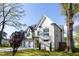 Beautiful two-story home with a brick exterior, large windows, and manicured lawn at 717 Penn Rd, Raleigh, NC 27604