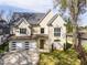 Charming two-story home with stone accents, a well-maintained lawn, and a two-car garage at 717 Penn Rd, Raleigh, NC 27604