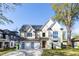 Beautiful two-story home with a two-car garage and a well-manicured front yard at 717 Penn Rd, Raleigh, NC 27604